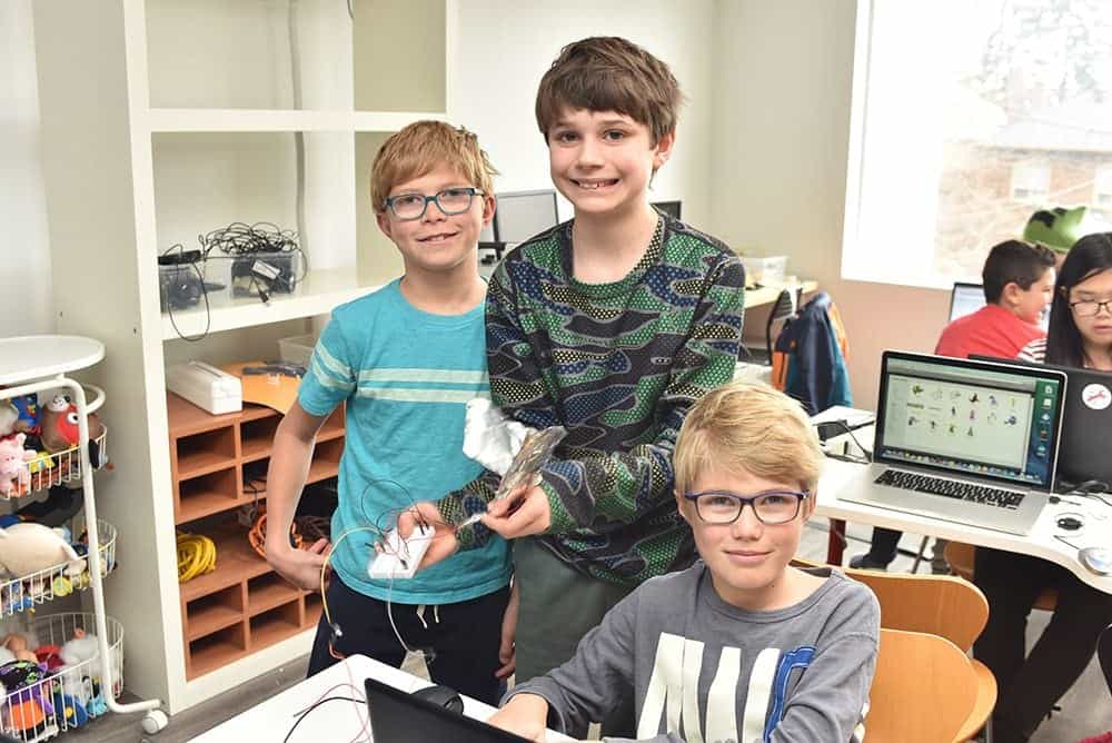 Boys learning with MakerKids at summer camps